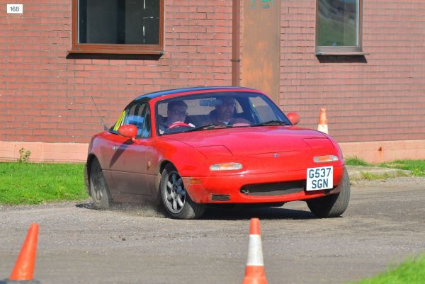 Red Mazda MX5 rally car